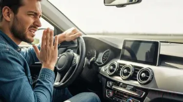 Car AC Smells Bad: Causes, Diagnosis & Fixes Before It Makes You Sick